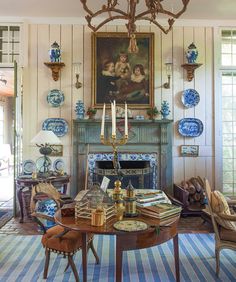 an image of a living room with blue and white decor on the fireplace mantel