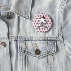 a button on the back of a jean jacket that has an image of a circle in it