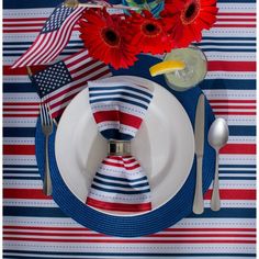 a patriotic place setting with red, white and blue napkins