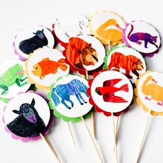 a bunch of cupcake toppers with animals on them