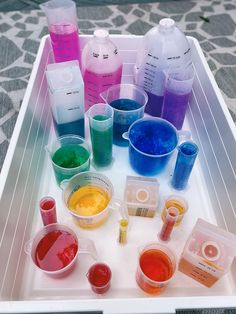 a tray filled with lots of different colored liquids