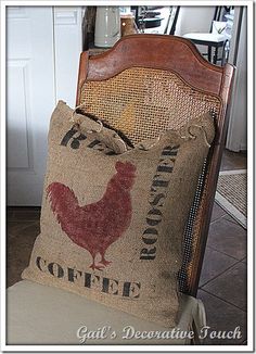 a chair with a pillow on it sitting next to a coffee bag and some other items