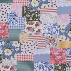 a patchwork quilt with many different colors and patterns on it's sides, including flowers