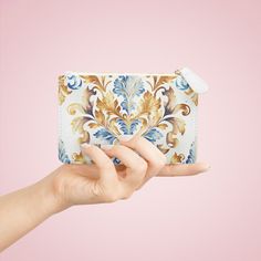 Hey there fashionistas! Are you always on the go but still want to look stylish? Our Blue and Gold Damask Mini Clutch Bag is perfect for you! It's designed with a loop handle, so you can easily free up your hands while carrying it around. Not only is it convenient, it's also roomy enough to hold all your daily essentials like your phone, wallet, and keys. Plus, it features a zip fastening to keep everything secure, and a fully lined internal pocket to keep your stuff organized. The best part? Ou Soft Bristle Brush, Daily Essentials, Phone Wallet, Blue And Gold, Stain Remover, Blue Bags, Clutch Purse, Damask, Inside Pocket