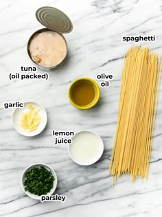 ingredients to make pasta laid out on a marble surface