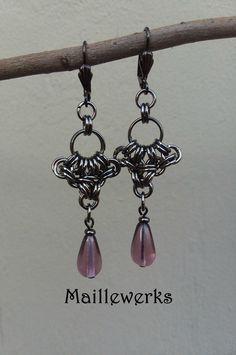 These Long and Dramatic Chainmaille Earrings are handcrafted with Amethyst Purple Glass Teardrops and more than 60 antiqued black gunmetal plated metal jump rings.  Gunmetal Lever Back Ear Wires for pierced ears.   Earring Length from top of Ear Wires to bottom 2 3/4" (7 cm) long and 3/4" (2 cm) wide. Wonderful gift for that special February born person in your life! Necklace sold separately. See matching Necklace here!: https://www.etsy.com/Maillewerks/listing/1454765426 Chainmaille has a fluid Gunmetal Jewelry, Chainmaille Earrings, Chainmaille Jewelry, Chainmail Jewelry, Chain Maille Jewelry, February Birthday, Anniversary Jewelry, Amethyst Purple, Purple Glass