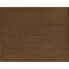 a brown rug with an area rug in the middle that is very soft and clean