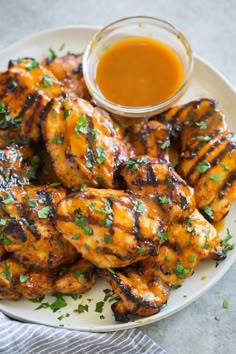 grilled chicken wings with sauce and parsley on the side