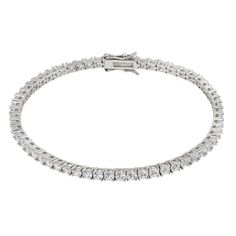 Illuminate your look with our Simulated Diamond Tennis Bracelet in Silver. This exquisite bracelet features simulated diamonds that sparkle brilliantly along its entire length. Each stone is meticulously set to maximize its shine, offering an elegant touch to any outfit. The bracelet is equipped with a secure tongue and box fastening, ensuring it stays in place with ease.   The bracelet effortlessly blends sophistication and comfort. Perfect for both everyday wear and special occasions, it's the Classic Crystal Tennis Bracelet With Brilliant Cut, Classic Sparkling Diamond White Bracelets, Classic Sparkling Diamond White Bracelet, Classic Crystal Diamond Bracelet With Sparkly Stones, Classic Diamond Bracelet With Sparkling Stones, Luxury Crystal Tennis Bracelet With Sparkling Stones, Luxury Tennis Bracelet With Sparkling Cubic Zirconia, Classic Crystal Diamond White Bracelet, Classic Sparkling Cubic Zirconia Bracelets