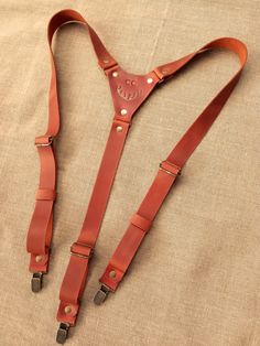 Personalized Brown Leather Country Suspenders always make a great gift for a wedding, Christmas, birthday, Father's day. You will look unique at any party. Personalized leather suspenders made of high quality leather "Сrazy Horse". Leather "Сrazy Horse" with aging effect, it becomes a luxurious leather vintage look over time and adds style and fashion charm. Leather "Сrazy Horse" - 100% mat genuine cowhide leather (calf leather) with a waxy coating.               PERSONALIZATION FOR FREE! ►You c Brown Leather Suspenders Wedding, Leather Suspenders Wedding, Groom Suspenders, Men's Suspenders, Wedding Suspenders, Suspenders Wedding, Suspenders Men, Leather Suspenders, Un Logo