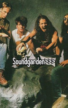 the soundgarden album cover art with four men sitting in front of a rock