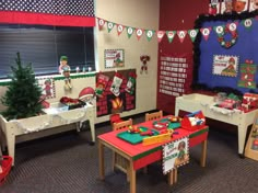 a classroom decorated for christmas with decorations on the wall and tables in front of them