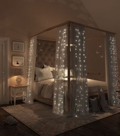 a canopy bed with white lights on it