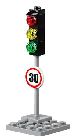 a traffic light with a sign that says 30 on the front and below it is an image of a stoplight