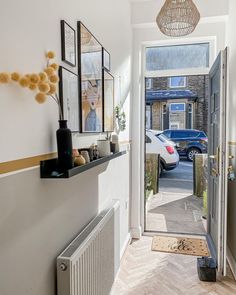 an entry way leading to a car parked in the driveway