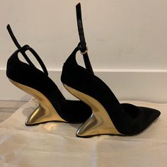 New Ferragamo Black Velvet And Gold Pumps. Feature High Sculpted Gold Wedge Heel And Ankle Strap With Adjustable Buckle. Vintage Style, Perfect For Holiday Parties. Never Worn Outside The House. Size 36. Made In Italy. Vintage Ferragamo Shoes, Black Classy Heels, Gold Calf Leather Heels With Pointed Toe, Luxury Wedge Heels With Leather Sole, Luxury Gold Suede Heels, Calf Leather Wedge Heels For Evening, Designer Suede Heels For Formal Occasions, Gold Suede Pointed Toe Heels, Designer Wedge Heel For Formal Occasions