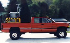 a red pick up truck parked in front of a house