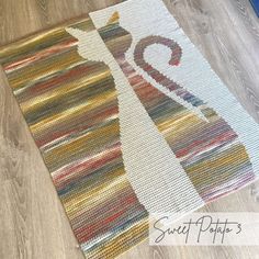 the rug is made with yarn and has a giraffe design on it