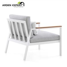 a white chair with a wooden armrest and seat cushion on the back, in front of a white background