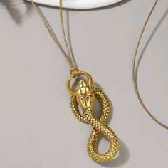 This Unique Piece Is A Wonderful Addition To Your Wardrobe And Your Style; Sure To Get Lots Of Compliments! Great For Halloween Or Anytime! Gsun1s50u000gmg Symbolic Snake-shaped Necklace For Gift, Luxury Unique Snake Necklace, Metallic Necklace, Spiritual Snake-shaped Necklace For Gifts, Yellow Gold Snake-shaped Necklace For Gift, Gold Snake-shaped Metal Necklace, Serpent Snake, Aries Necklace, Silhouette Necklace