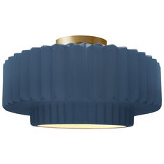 a blue ceiling light with a gold ring on the bottom and an oval shade over it