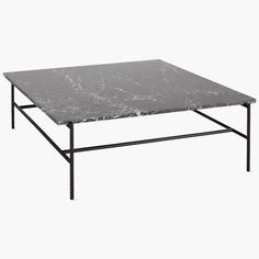 a marble top coffee table with black metal legs and an iron frame on the bottom