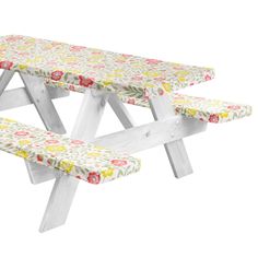 two wooden benches with floral fabric on them