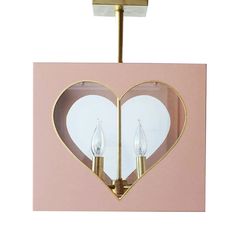 a pink and gold heart shaped light fixture with two lights on each side, in the shape of a heart