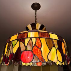 a stained glass lamp hanging from the ceiling