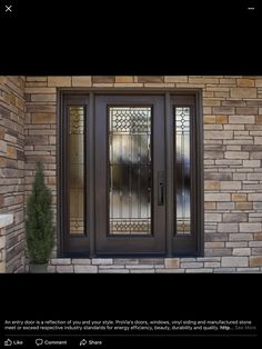 the front door to a home with glass panels on it's side and brick wall