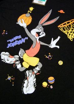 a t - shirt with an image of peter rabbit holding a basketball