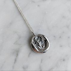 This 1/2" tall sterling silver charm is made from an antique wax seal that was hand carved in the 1920's. This charm has a beautiful lady holding a rose and it hangs from a sterling silver chain. This necklace is a Leviticus original and is handcrafted at the time of order and takes 3-4 weeks to ship. Wax Seal Pendant, Black Cat Necklace, Seal Necklace, Wax Seal Necklace, Coffin Ring, Antique Wax, Eye Ring, Cat Necklace, Pet Necklace