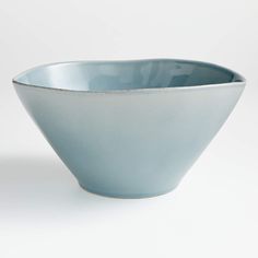 a blue bowl sitting on top of a white table