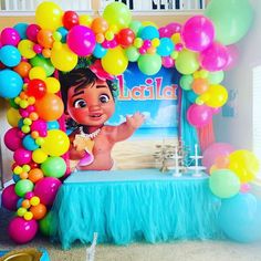 a birthday party with balloons and decorations