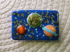 a blue tray with two small objects on it