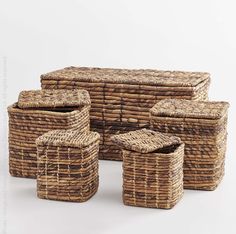 four wicker baskets stacked on top of each other