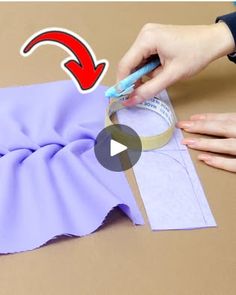 someone is cutting paper with scissors and tape