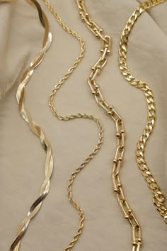 Details: - Curb, Rope and Twisted snake chain are 18K Gold Filled over copper - Link chain is gold plated over brass - This listing is only for ONE gold chain necklace - 100% hypoallergenic, Lead & Nickel Free Product care: - You can shower with it however you should avoid saltwater/ swimming pool/ jacuzzi since it can corrode the gold layer. - Avoid the jewelry coming into contact with perfume or lotions. - Store away in a box or keep it wrapped up. - Do not use abrasive compounds i.e. baki Christmas Jewelry Photoshoot, Chain Photoshoot, Gold Jewelry Photography, Necklace Photoshoot, Necklace Photography, Earring Bar, Chains Aesthetic, خواتم خطوبة, Necklace Stacking