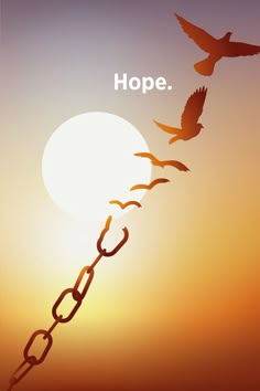 two birds are flying in the sky and one is chained to a chain that says hope