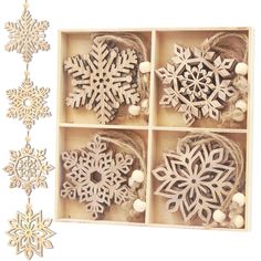 four snowflakes are in a wooden box