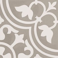 a white and gray tile with an ornate design