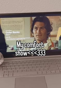 a cat sitting on the keyboard of a laptop computer that reads my comfort show > 333