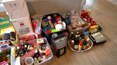 an assortment of food and condiments on the floor