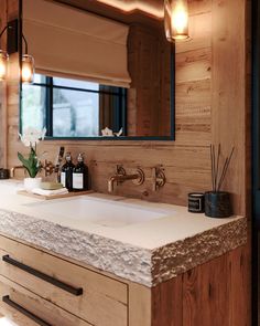 a bathroom sink with soap and toothbrushes on it