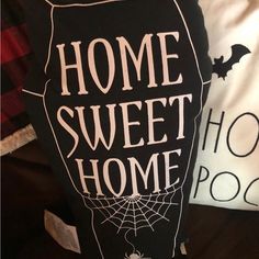 a black and white pillow with the words home sweet home on it