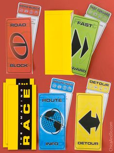 several different types of stickers on a red surface with the words road and direction