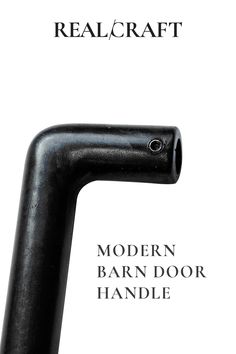 the back end of a black pipe with text reading realcraft modern barn door handle