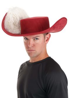 a man wearing a red and white hat with fur on the brim, standing in front of a white background