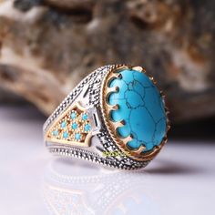 Turkish Jewelry Silver Men Ring Mens Handmade Ring, Ottoman Mens Ring, Blue Turquoise Stone, Gift for Him, 925k Sterling Silver Ring ABOUT PRODUCT  *   Material is 925K Sterling Silver and bronze  *   The stone is turquoise and zircon  *   Dimensions top of the ring: 15 mm * 20 mm  *   This product weight is 12.70 grams SHIPPING POLICY  We have economy and express shipping.  If you want, you can upgrade to express shipping. Delivery times: 3-12 business days > economy shipping 2-5 business days > express shipping RETURN POLICY  You can return the product within 30 days. ( after receiving ) For custom made products, return is not accepted. CUSTOMER SATISFACTION POLICY Your satisfaction is our priority. We guarantee you our products quality exceed its real value. All your questions will be a Luxury Turquoise Men's Ring With Polished Finish, Mens Turquoise Rings, Turkish Rings, Silver Men Ring, Mens Rings Fashion, Turquoise Ring Silver, Real Turquoise, Ring Mens, Turkish Jewelry