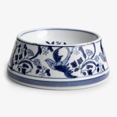 a blue and white bowl sitting on top of a table